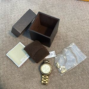 Michael Kors gold watch with original extra links for sizing